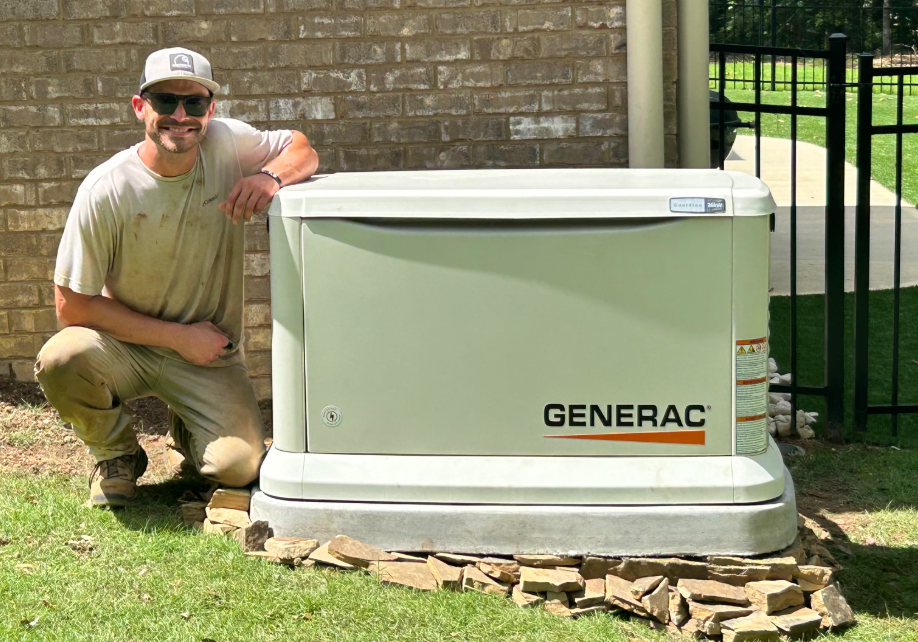 Abel Generators technician with an installed Generac standby generator